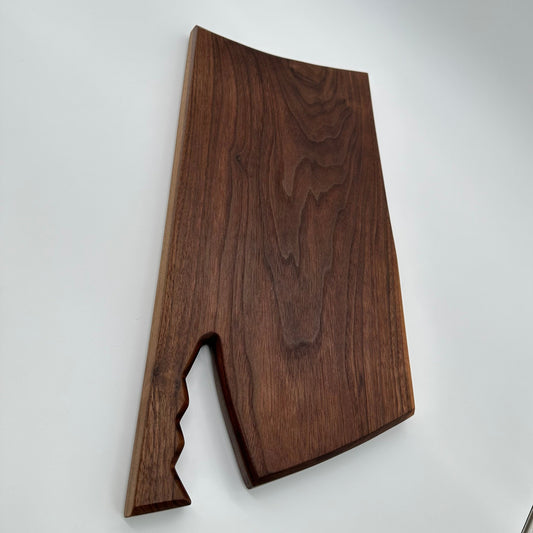 Walnut cutting/serving board with carved handle